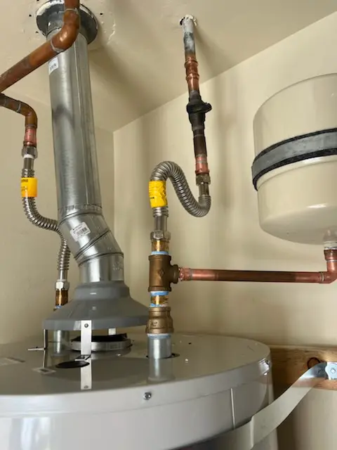 Water heater installation and plumbing repair in Ballouville